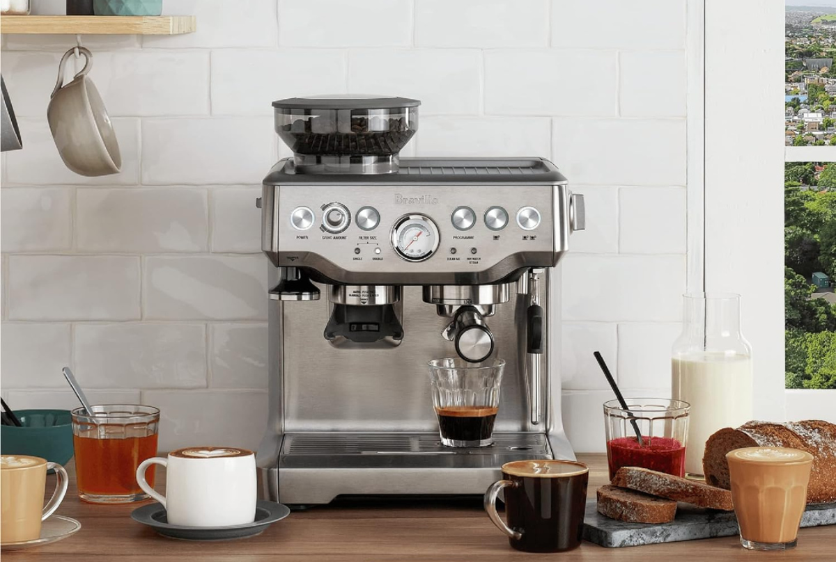 breville espresso machine on top of a wooden counter