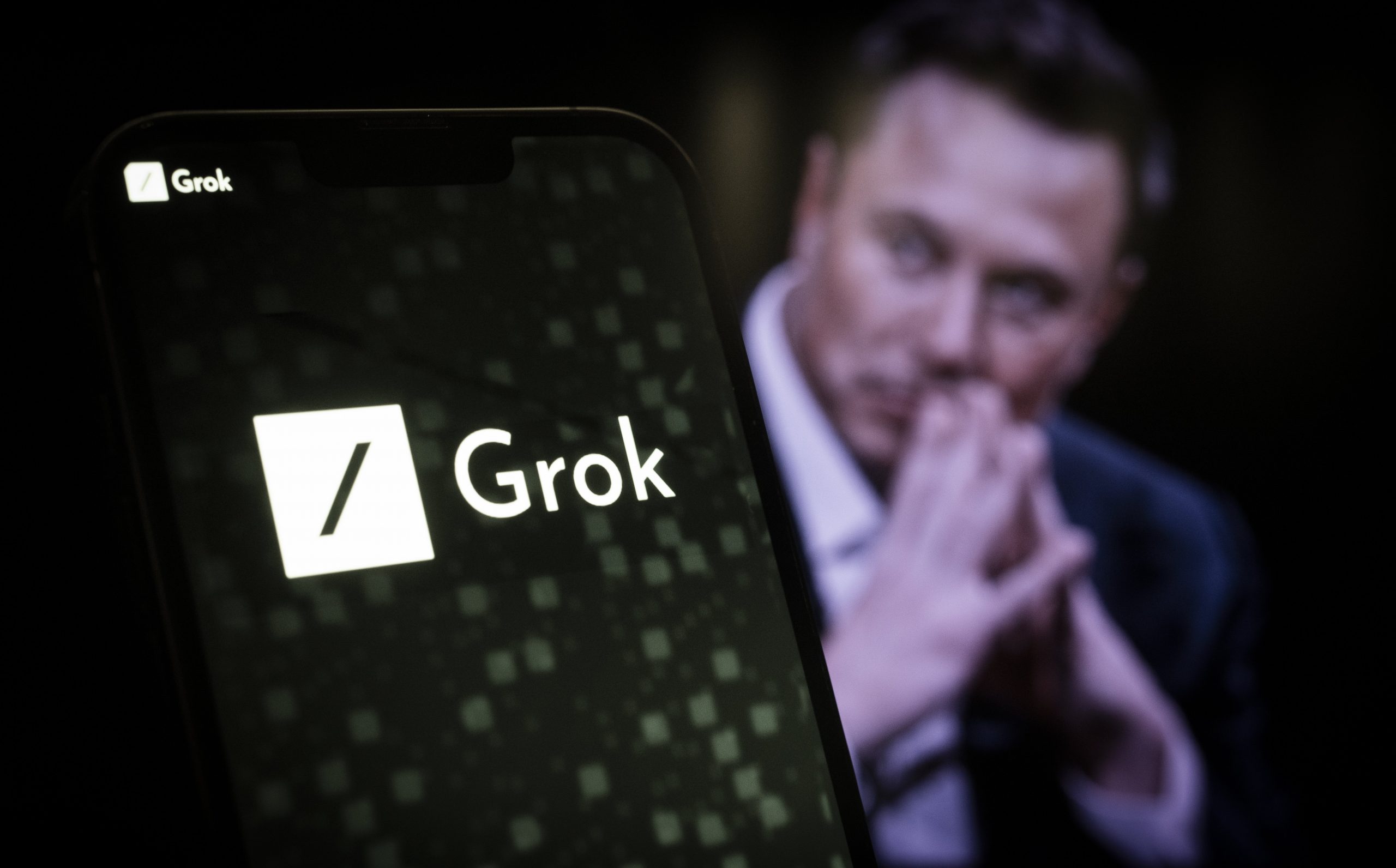 Elon Musk and Grok logo