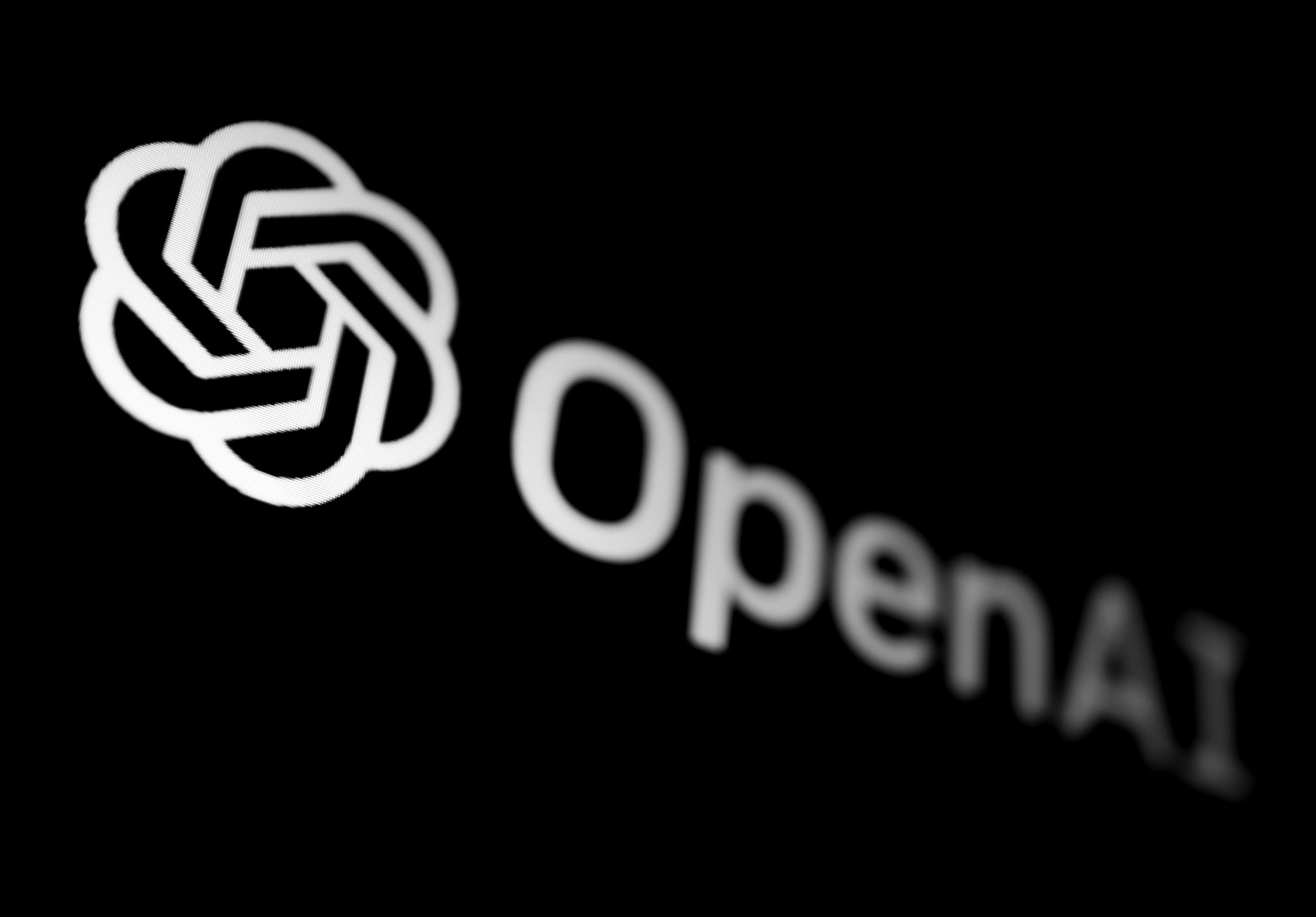 OpenAI logo displayed on a phone screen in this illustration