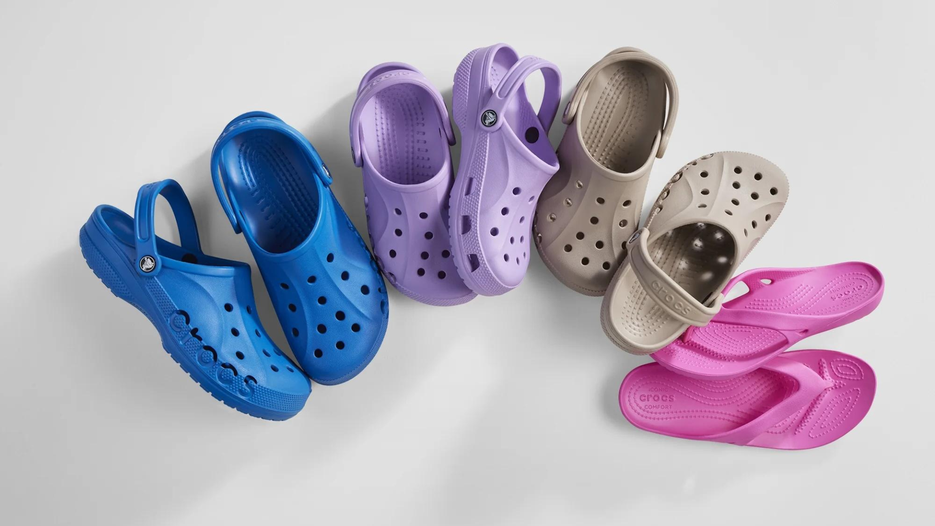 Four pairs of Crocs in an arch