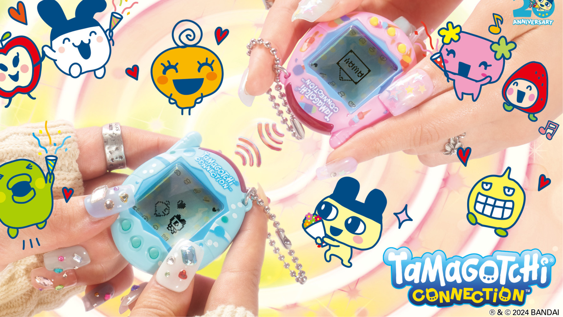 Two pairs of white hands each hold a Tamagotchi Connection, one in blue and one in pink.