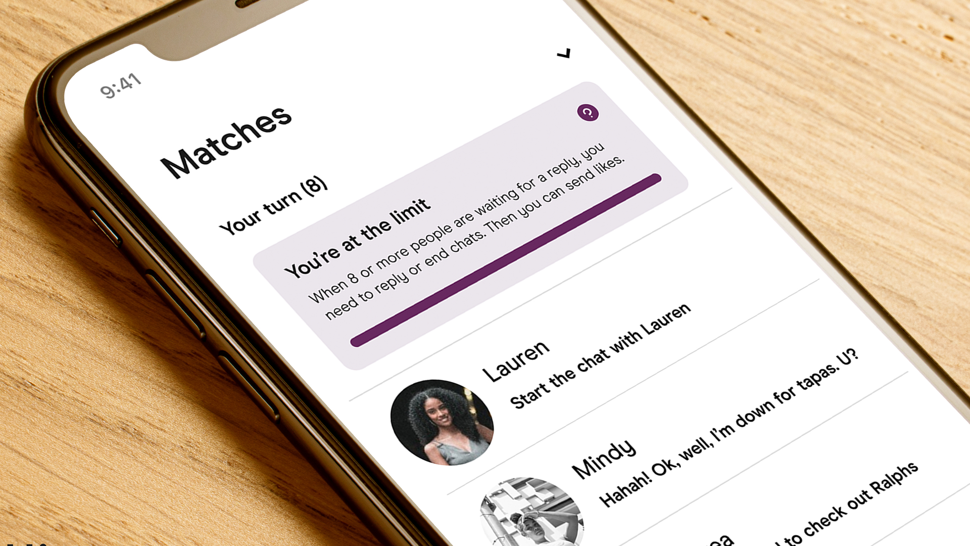 Hinge on phone showing banner on top of chats stating, 'You're at the limit.'