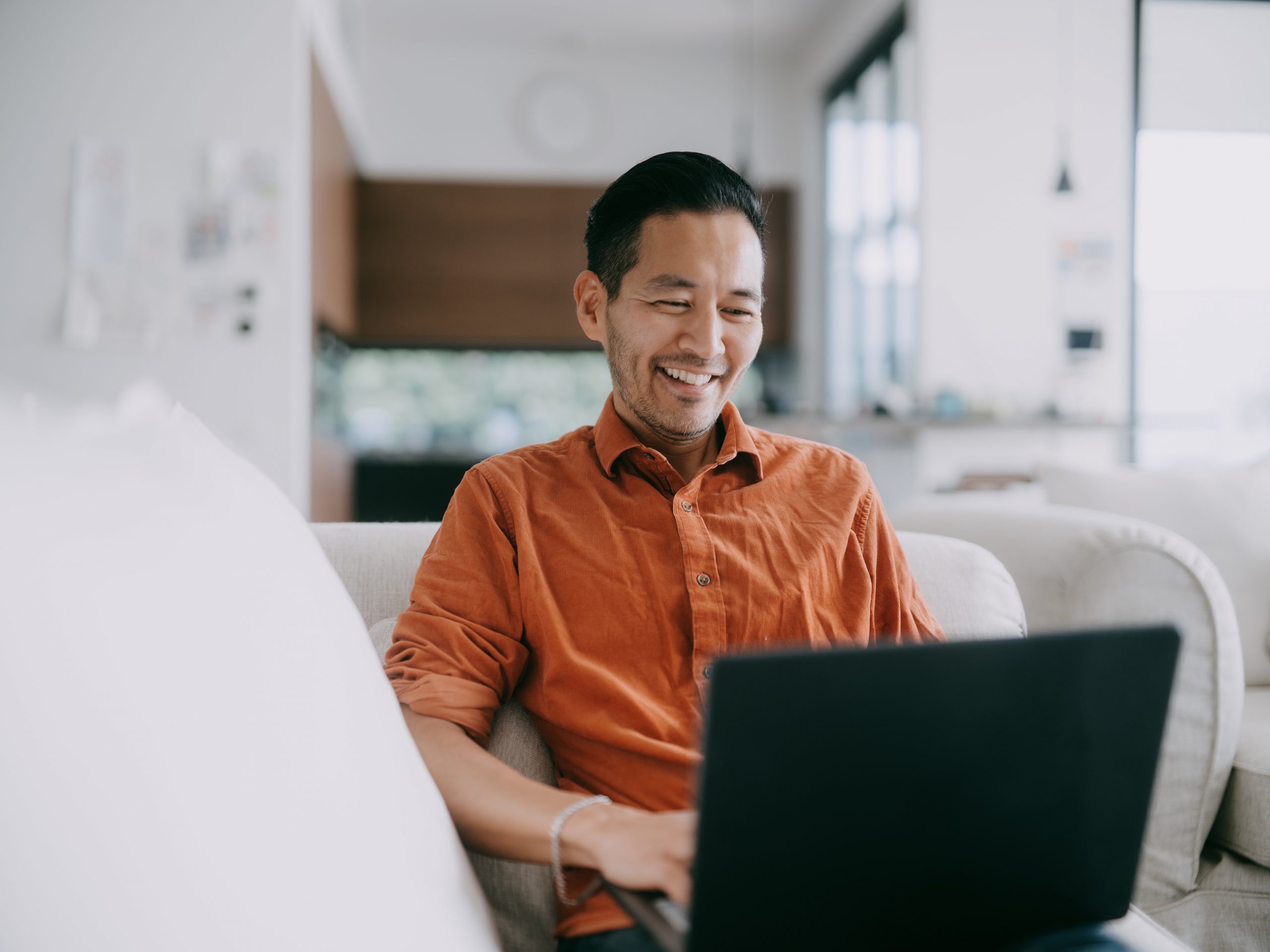 man working from home with laptop