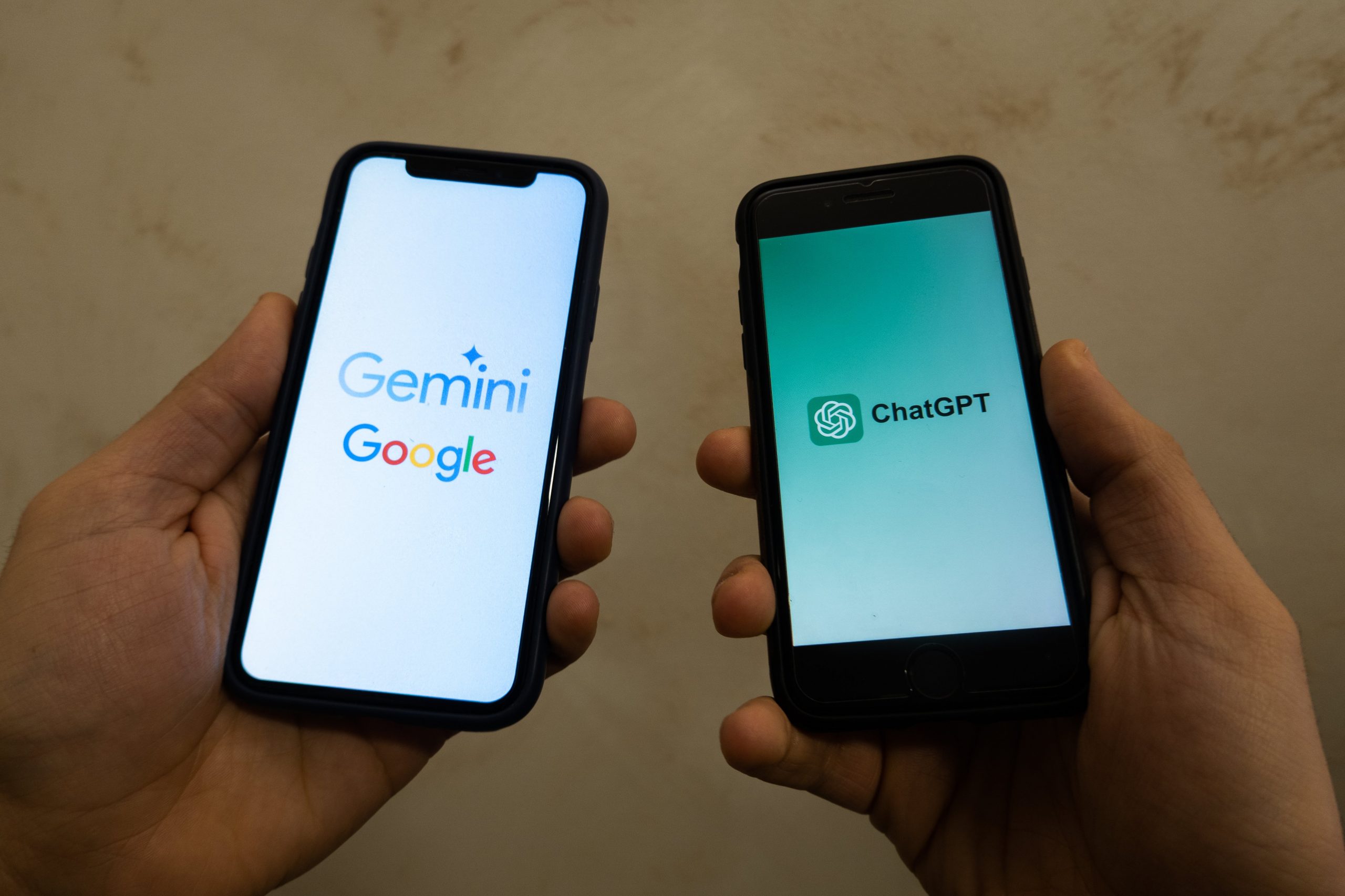 The Google and OpenAI logos on smartphones