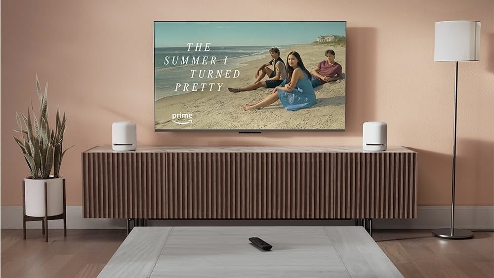 amazon fire stick on coffee table on tv with 'the summer i turned pretty' still 