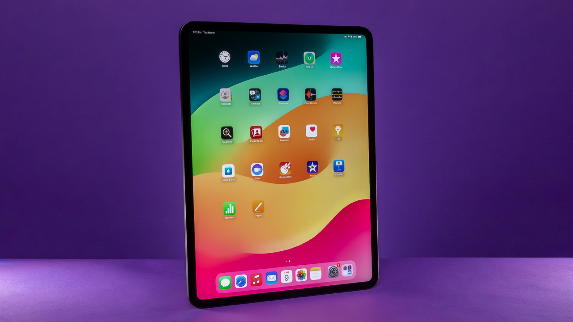 13-inch iPad Pro in front of a purple background and slightly tilted