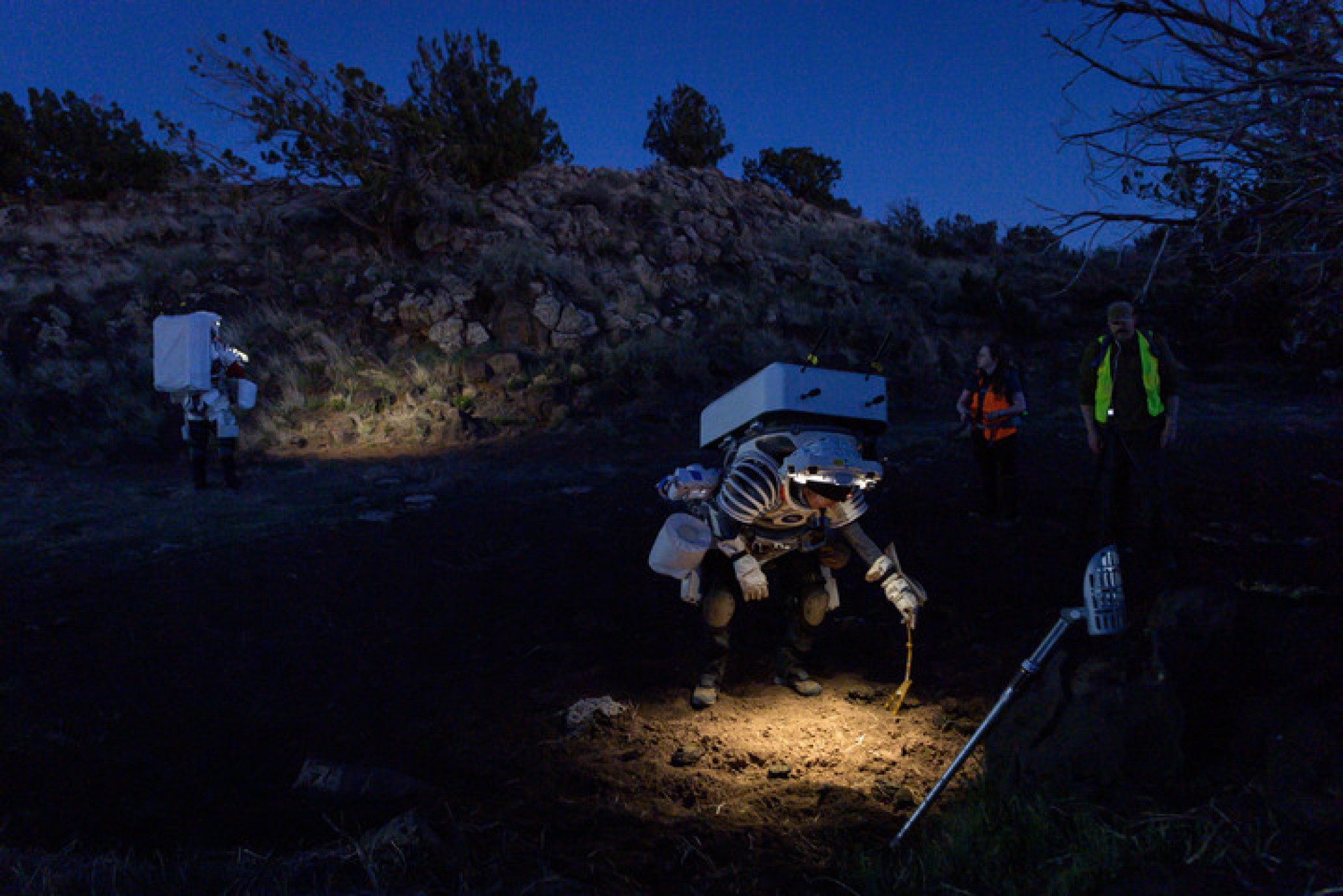 NASA astronauts Kate Rubins and Andre Douglas simulating a moonwalk for the looming Artemis 3 mission.