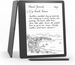 an amazon kindle scribe stands up on a white background with its included pen in the foreground