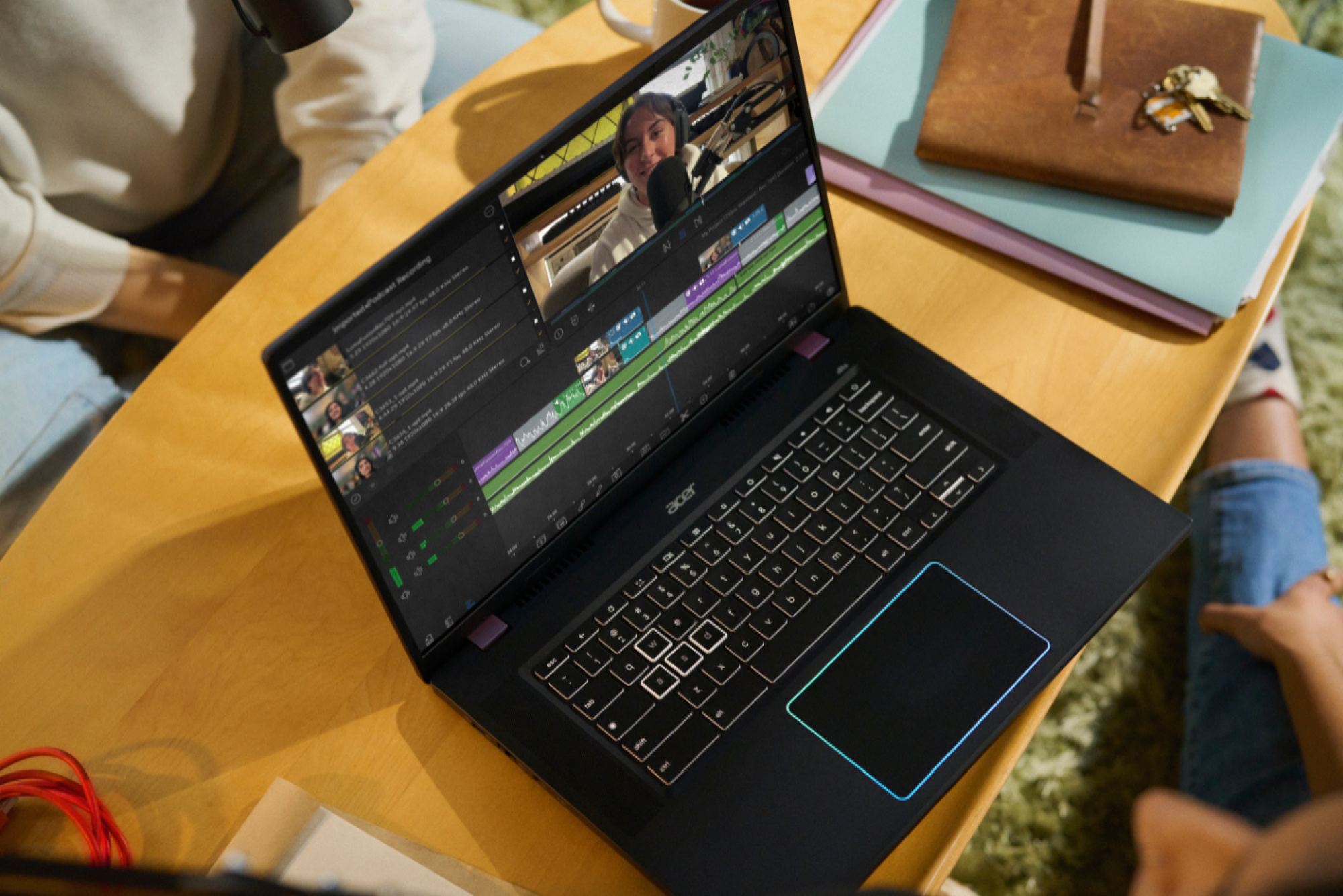 the Acer Chromebook Plus 516 GE on a desk displaying podcast software