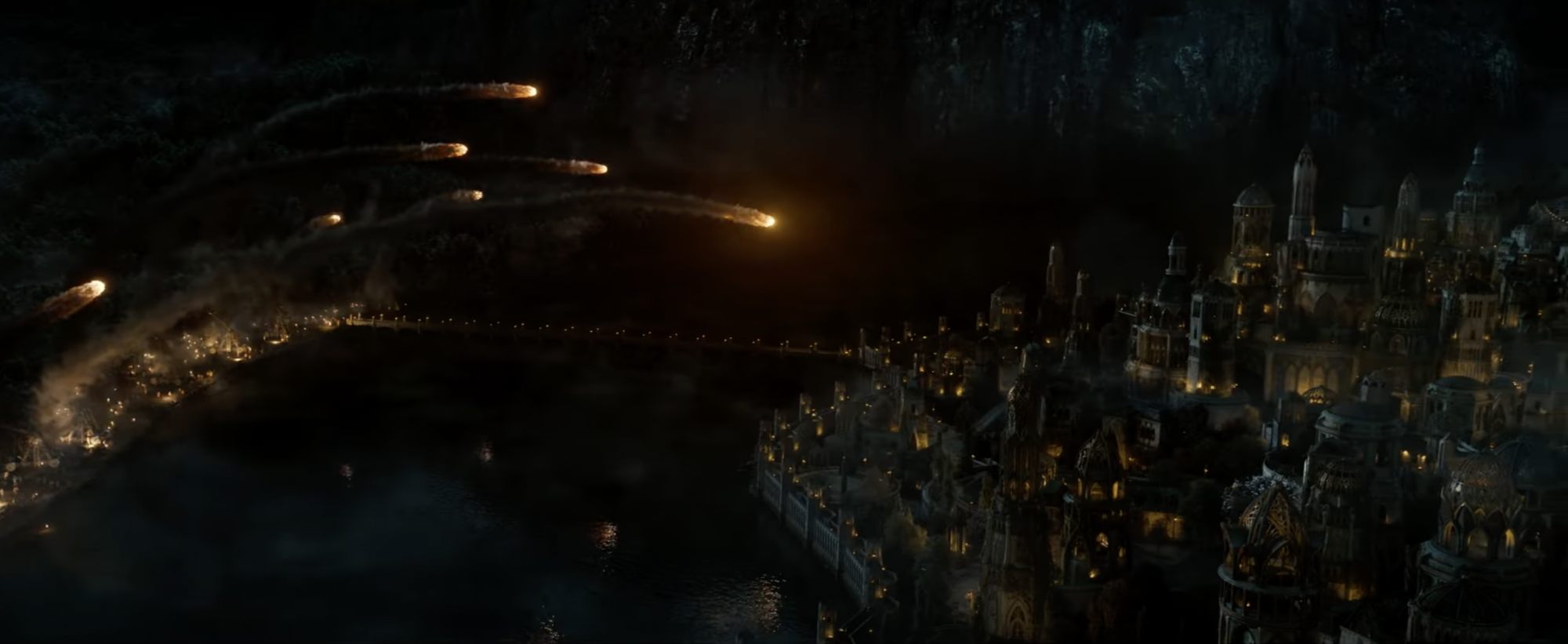 An army of catapults launches fiery rocks at an Elven city.