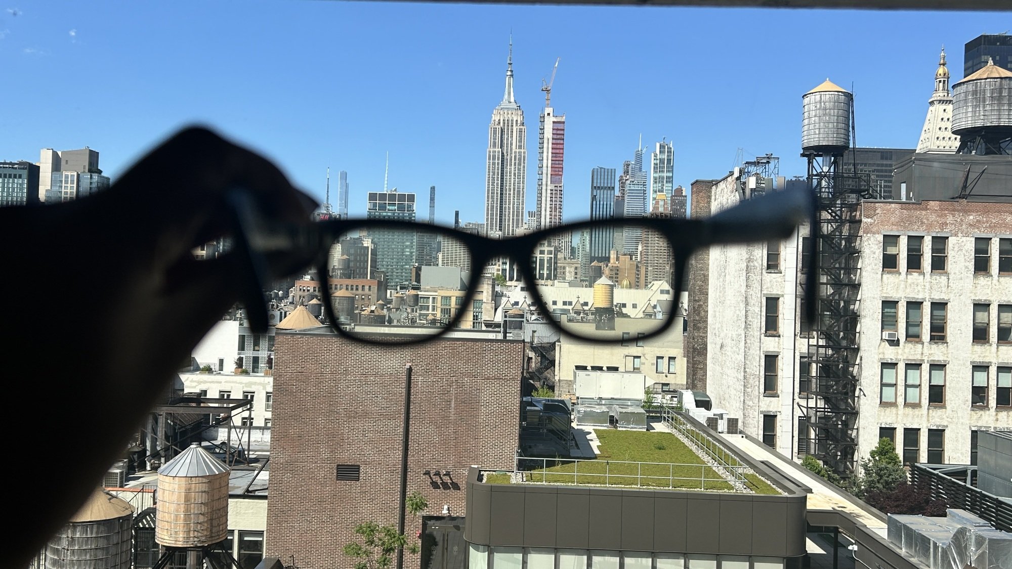 Ray-Ban Meta Smart Glasses with Empire State Building in the background.