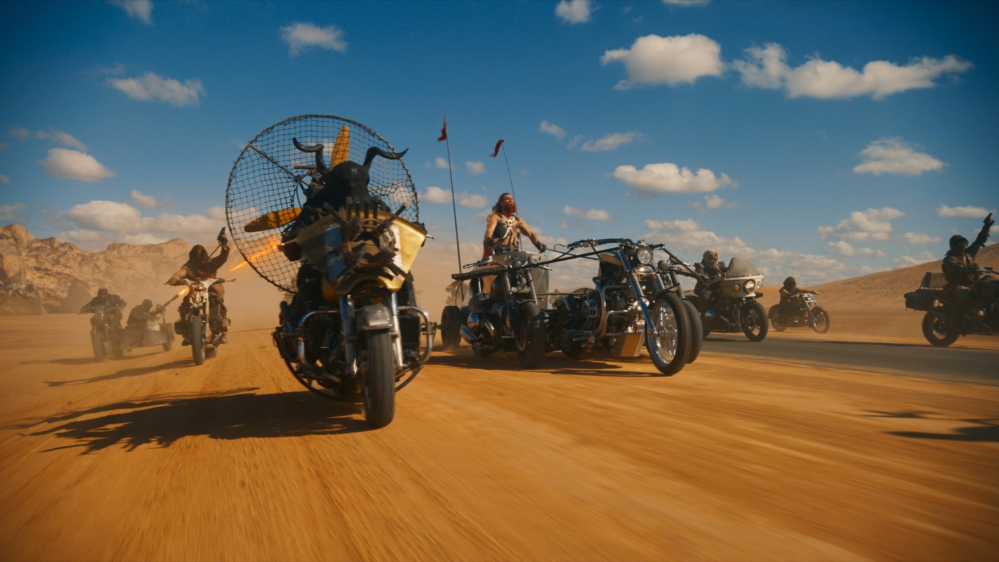 Vehicles race through the desert in "Furiosa: A Mad Max Saga."