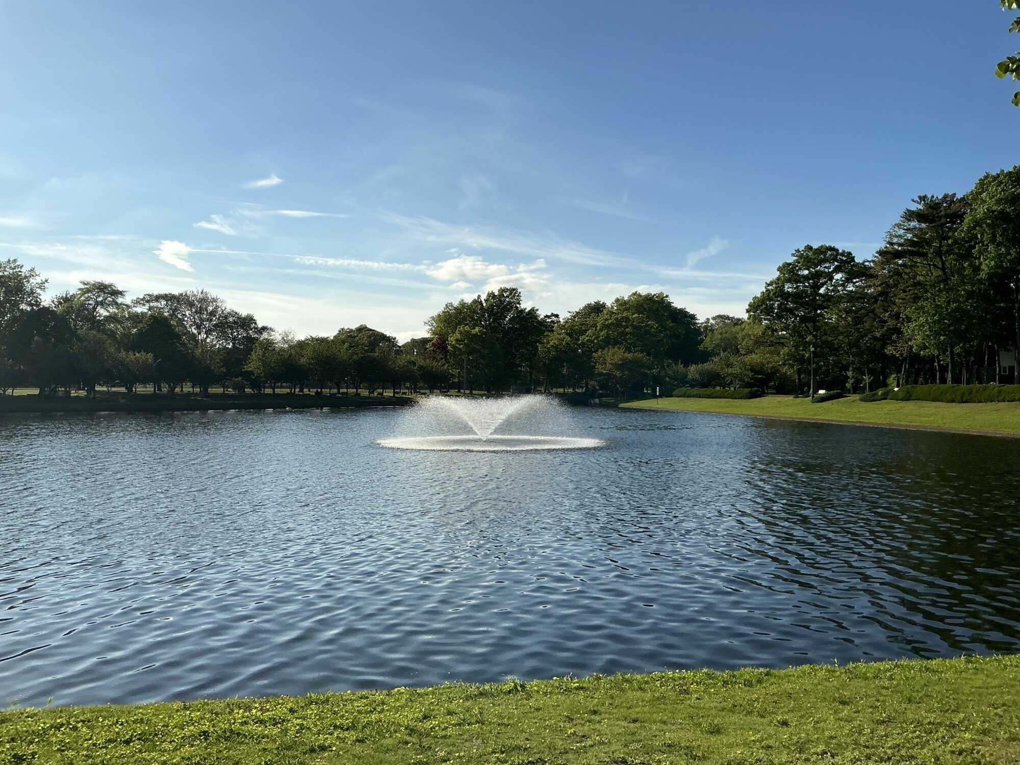 M4 iPad Pro capturing scenic area with a fountain in a pond aerating water