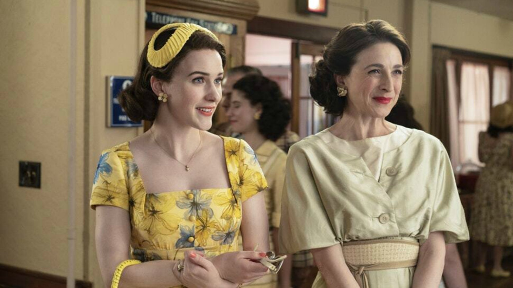 Two women in 1950s attire. 