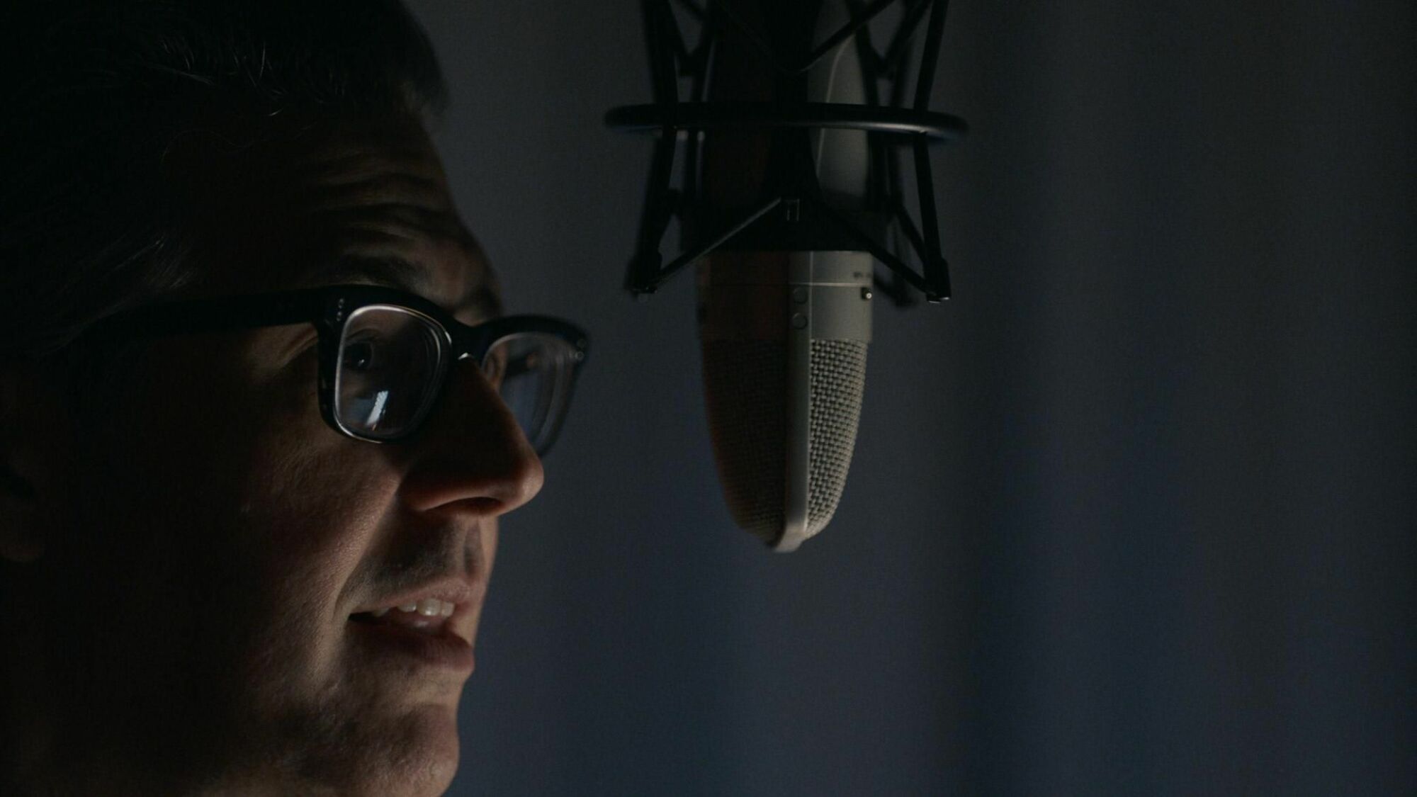 Ira Glass speaks into a microphone. 