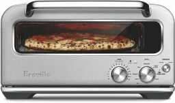 Breville pizza oven with pizza inside