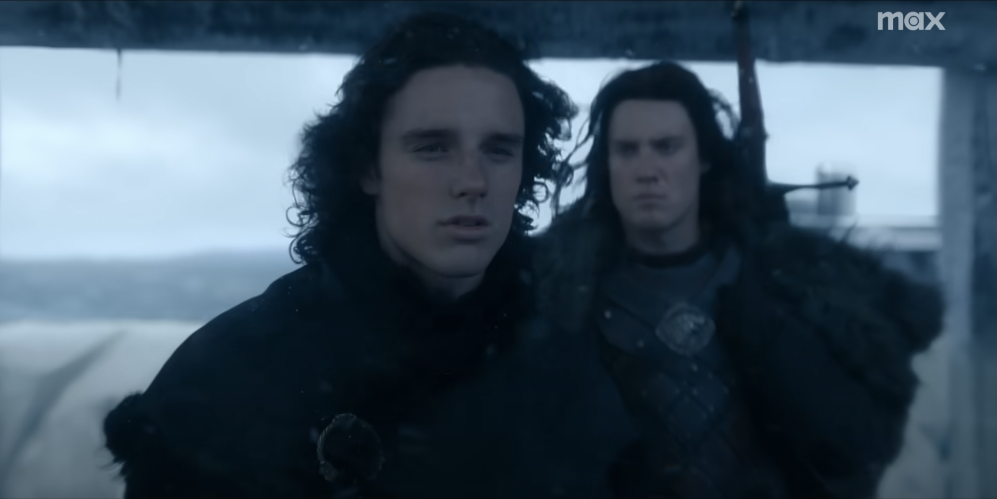 Harry Collett as Jacaerys Targaryen and Tom Taylor as Cregan Stark, standing atop the Wall.