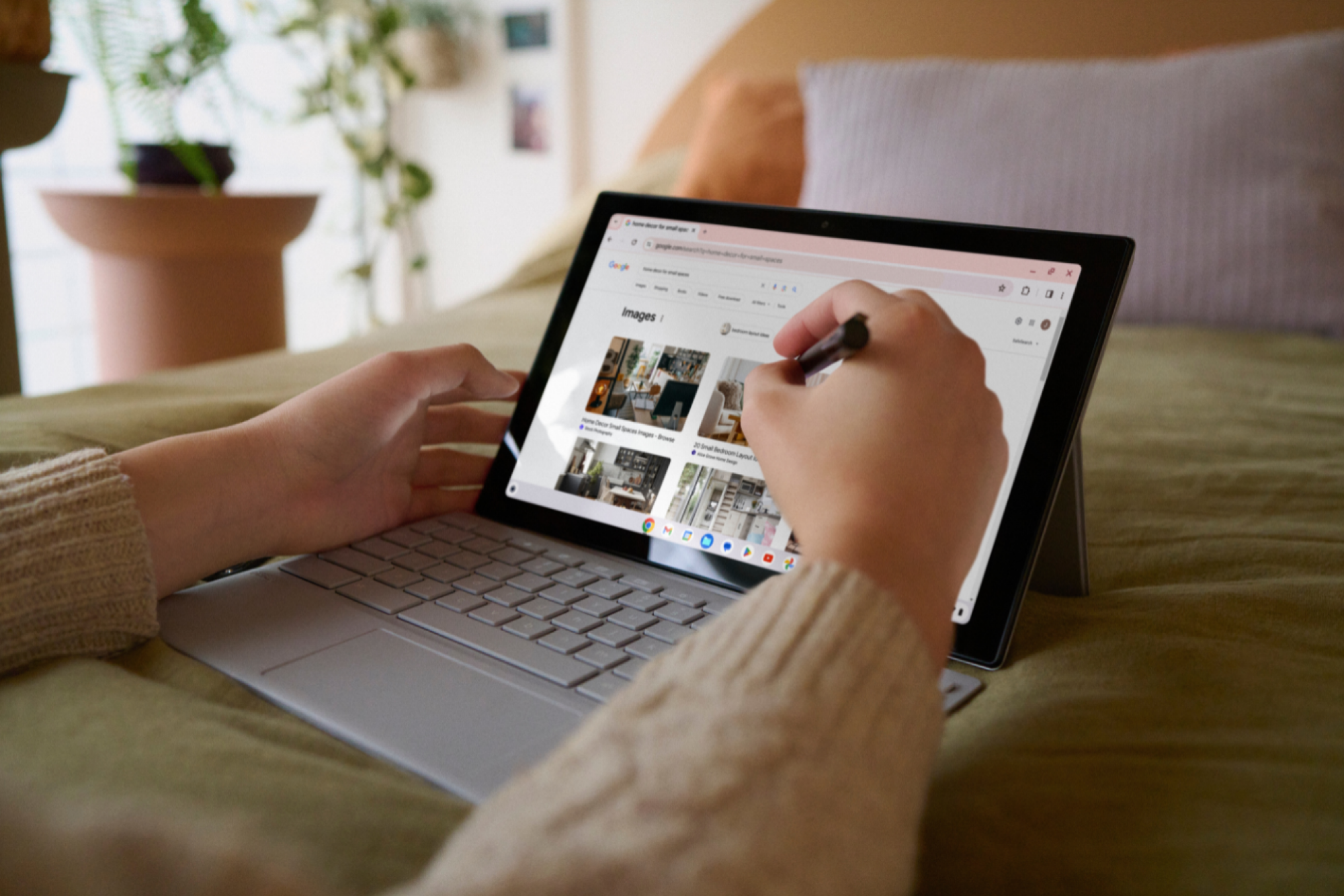 a close-up of a person writing on the Asus Chromebook CM30