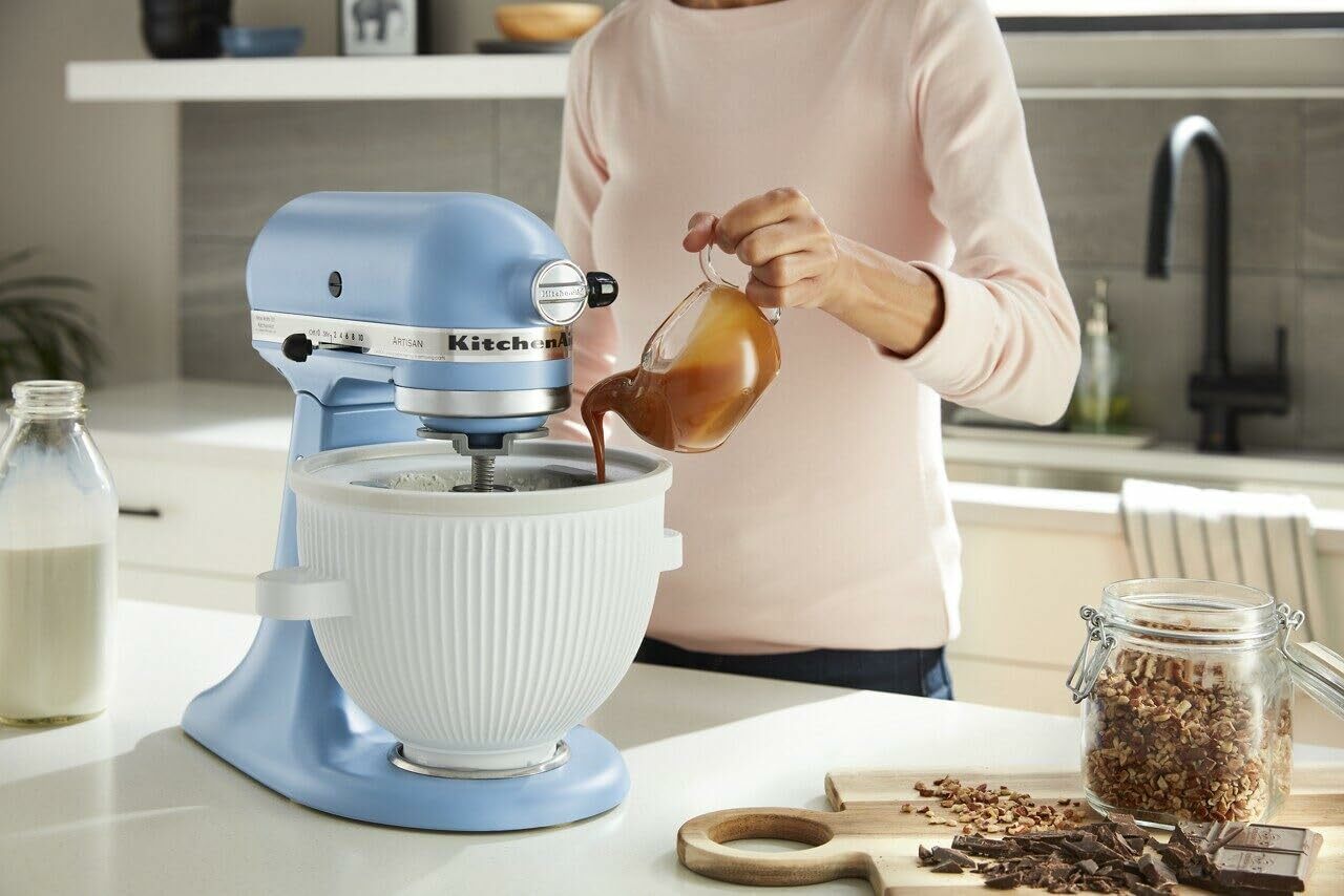 A woman makes ice cream using the KitchenAid ice cream attachment 