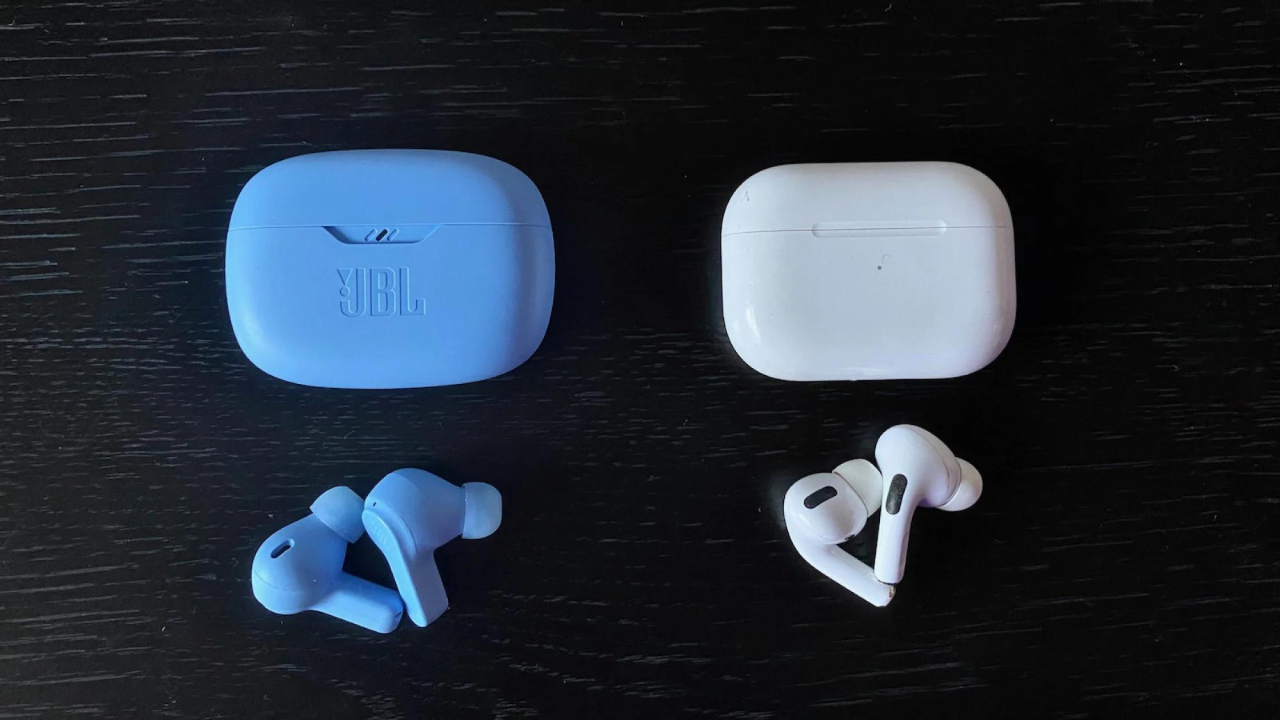 jbl vibe beam earbuds next to apple airpods