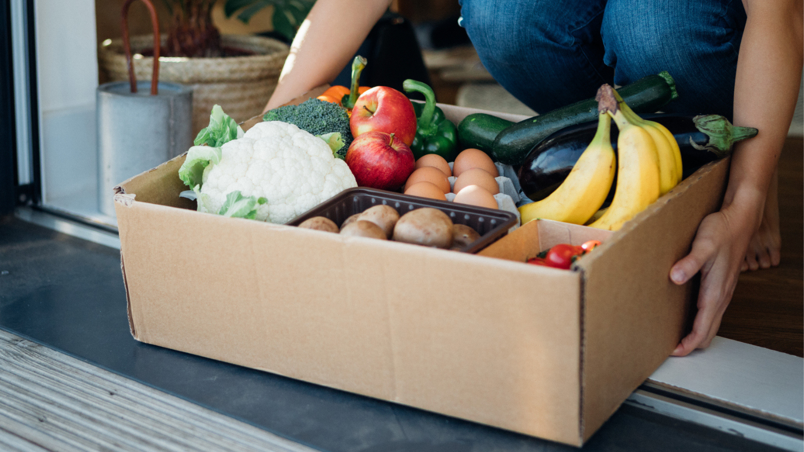 Young Woman Receiving Fresh Food Home Delivery - stock photo