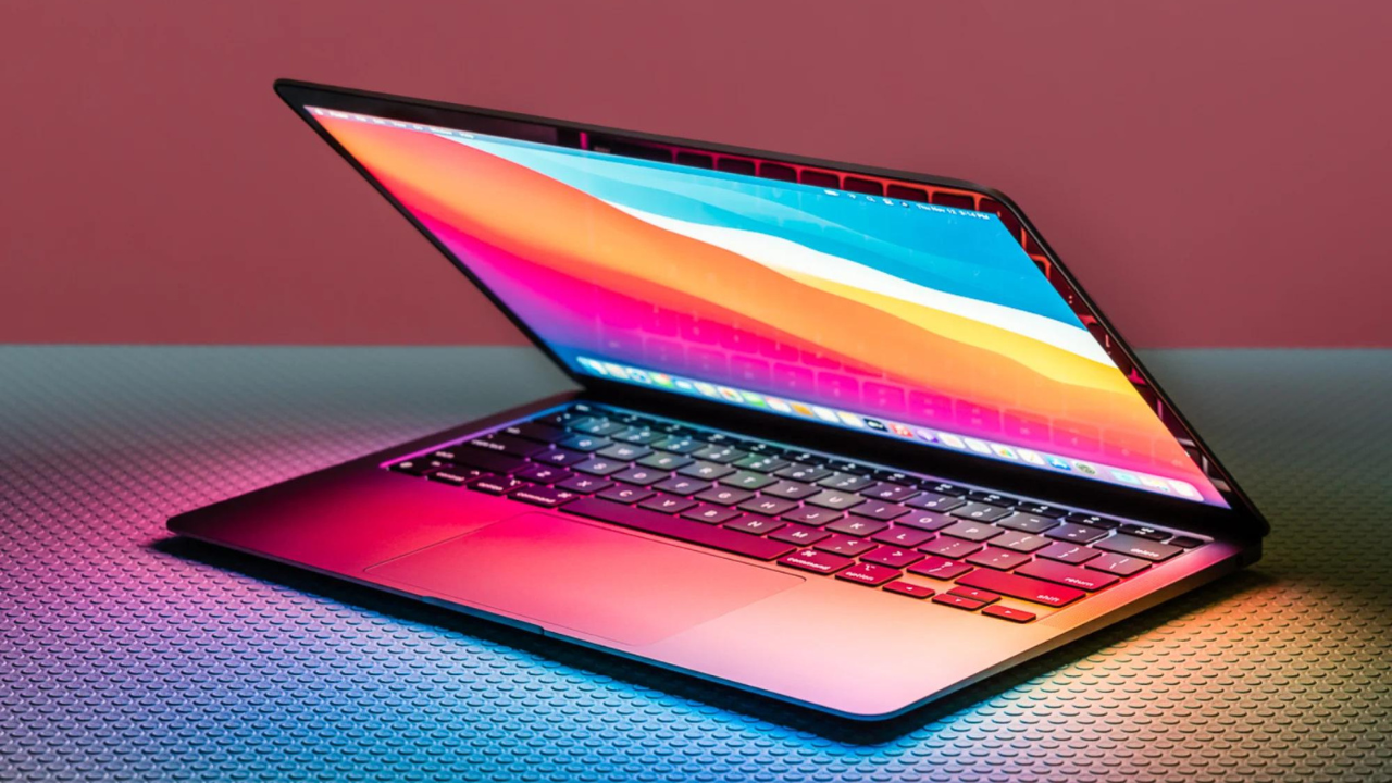 macbook surrounded by colorful lights