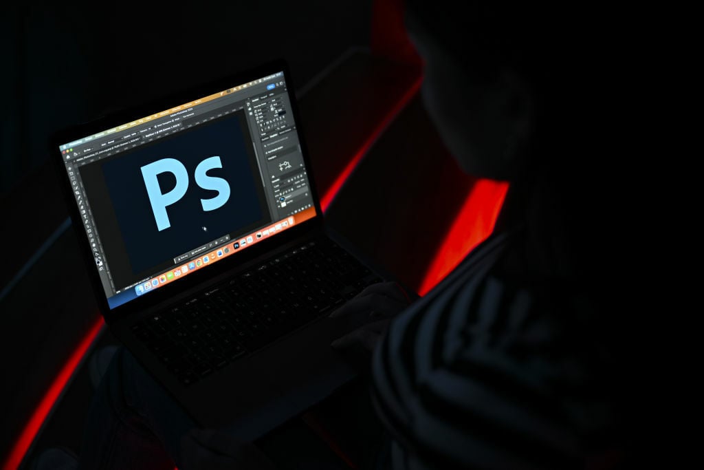 logo of 'Adobe Photoshop' is displayed on computer screen