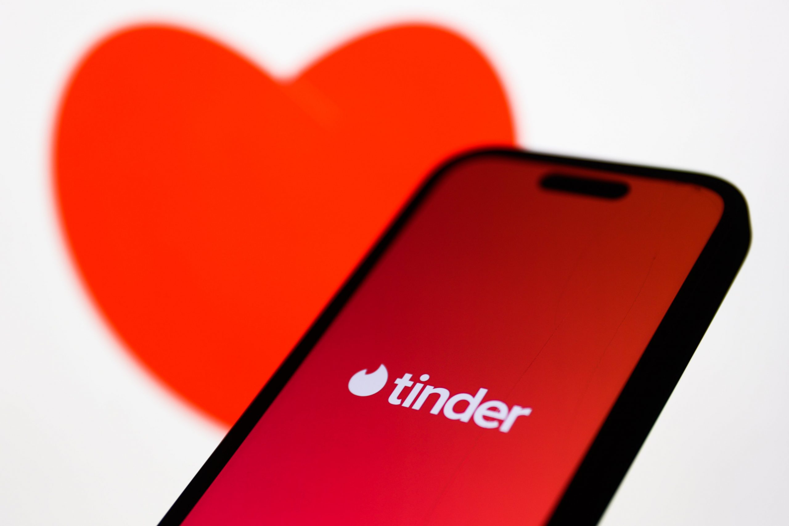 tinder on app with red heart background