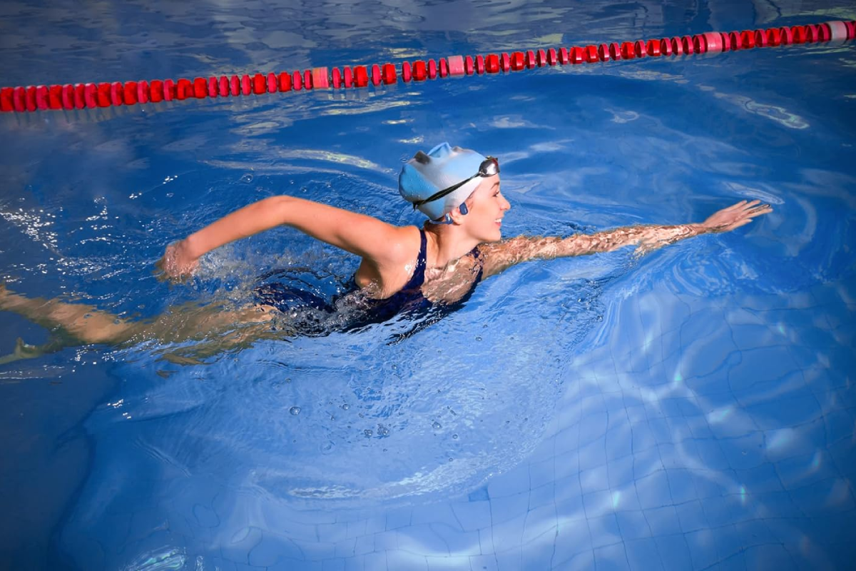 A women swimming in a pool