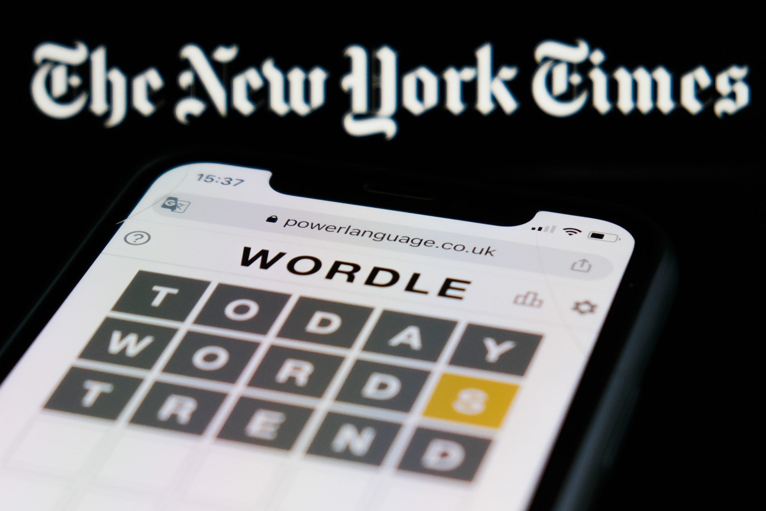 New York Times logo above Wordle on smartphone