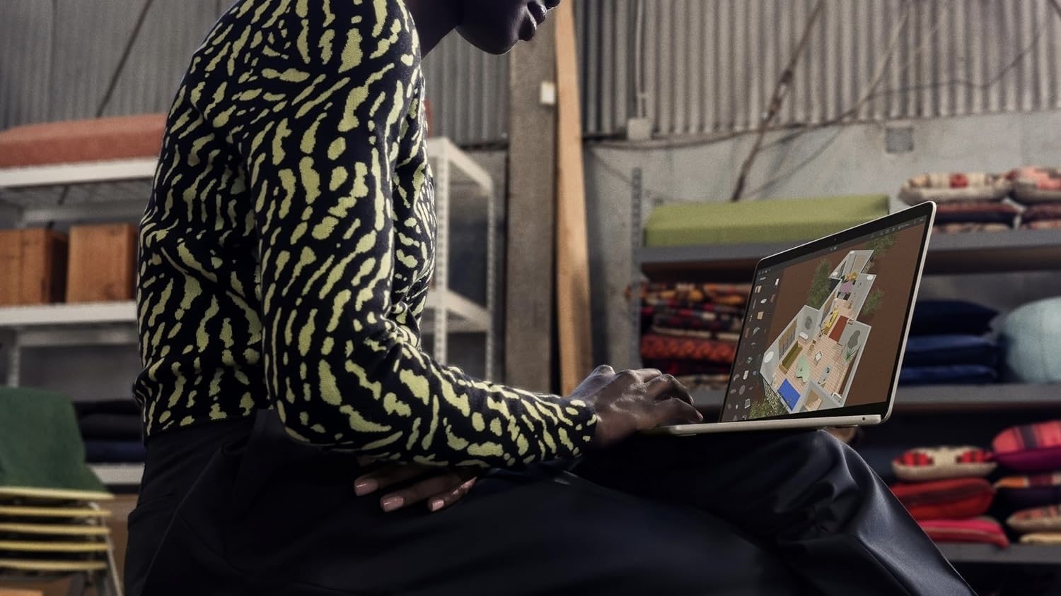 person working on m3 macbook air perched on their lap