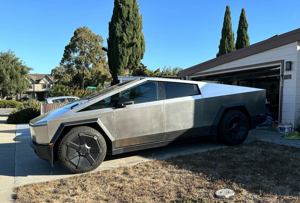 tesla cybertruck in a driveway