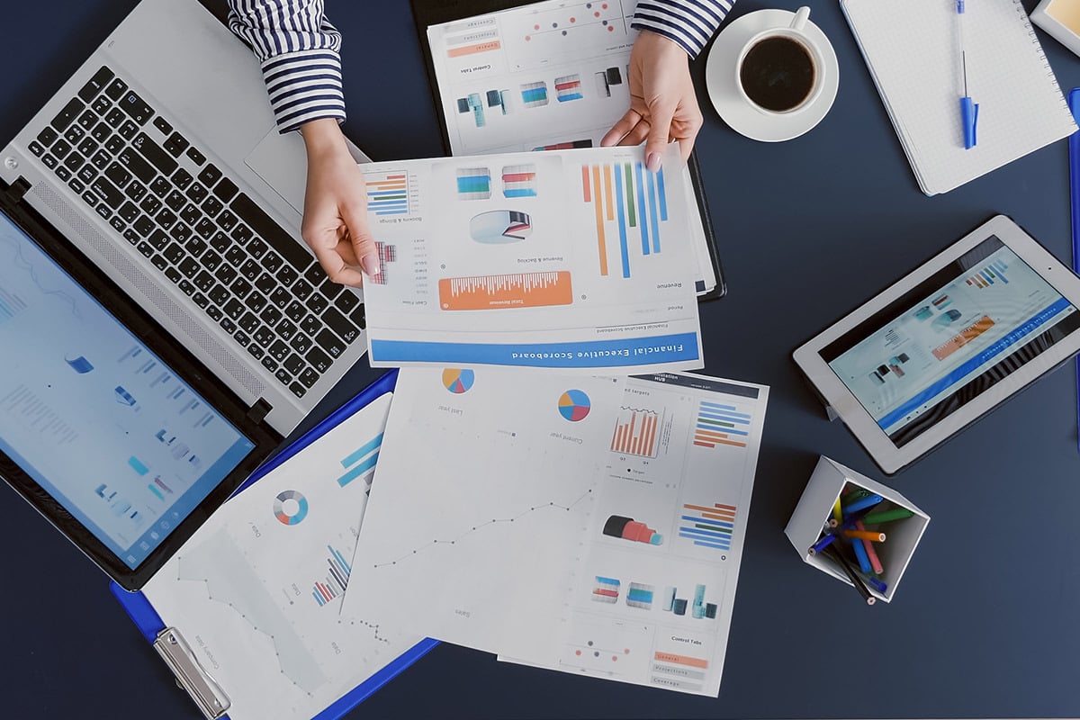 A person looking at charts at their desk