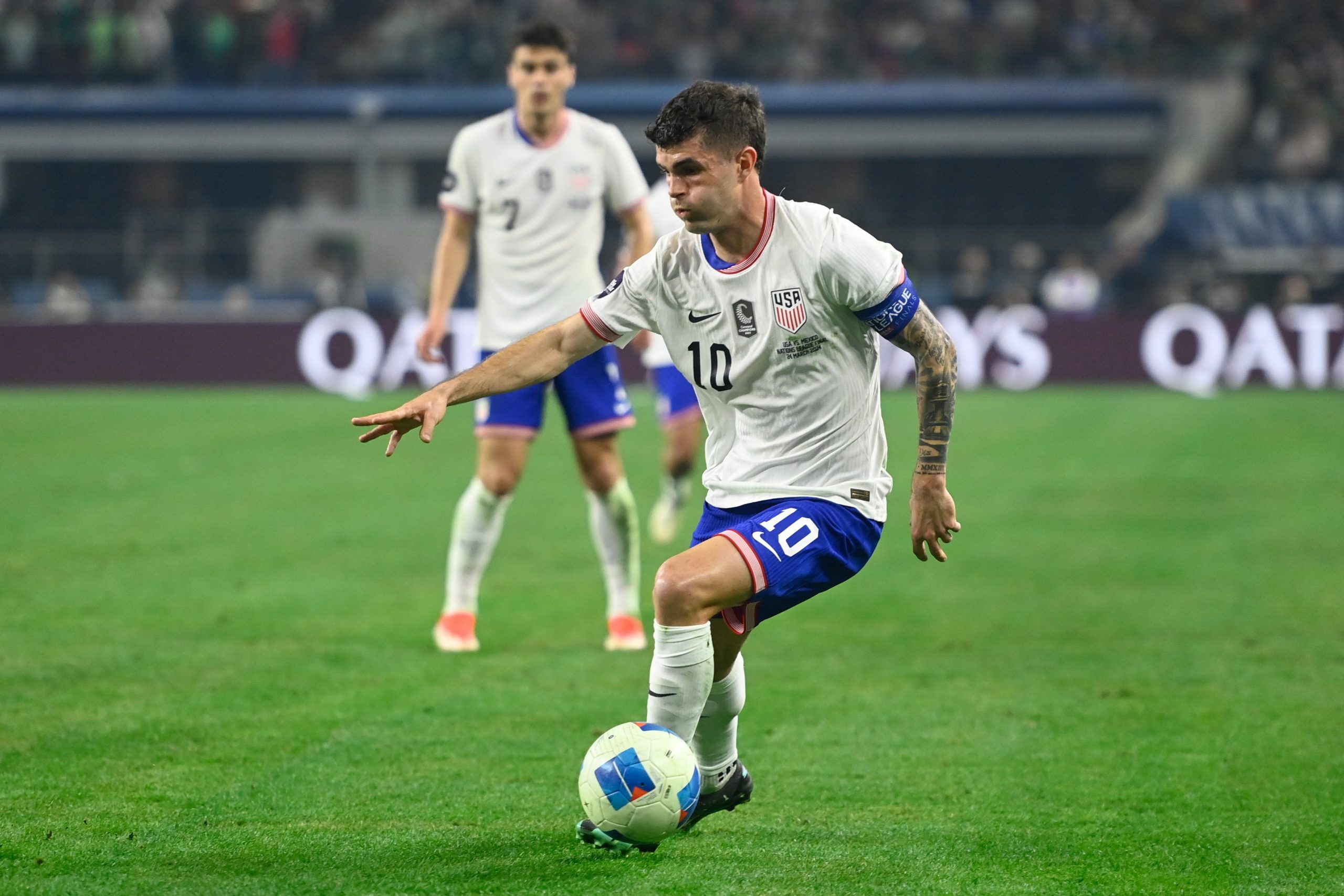 Christian Pulisic of the United States drives the ball