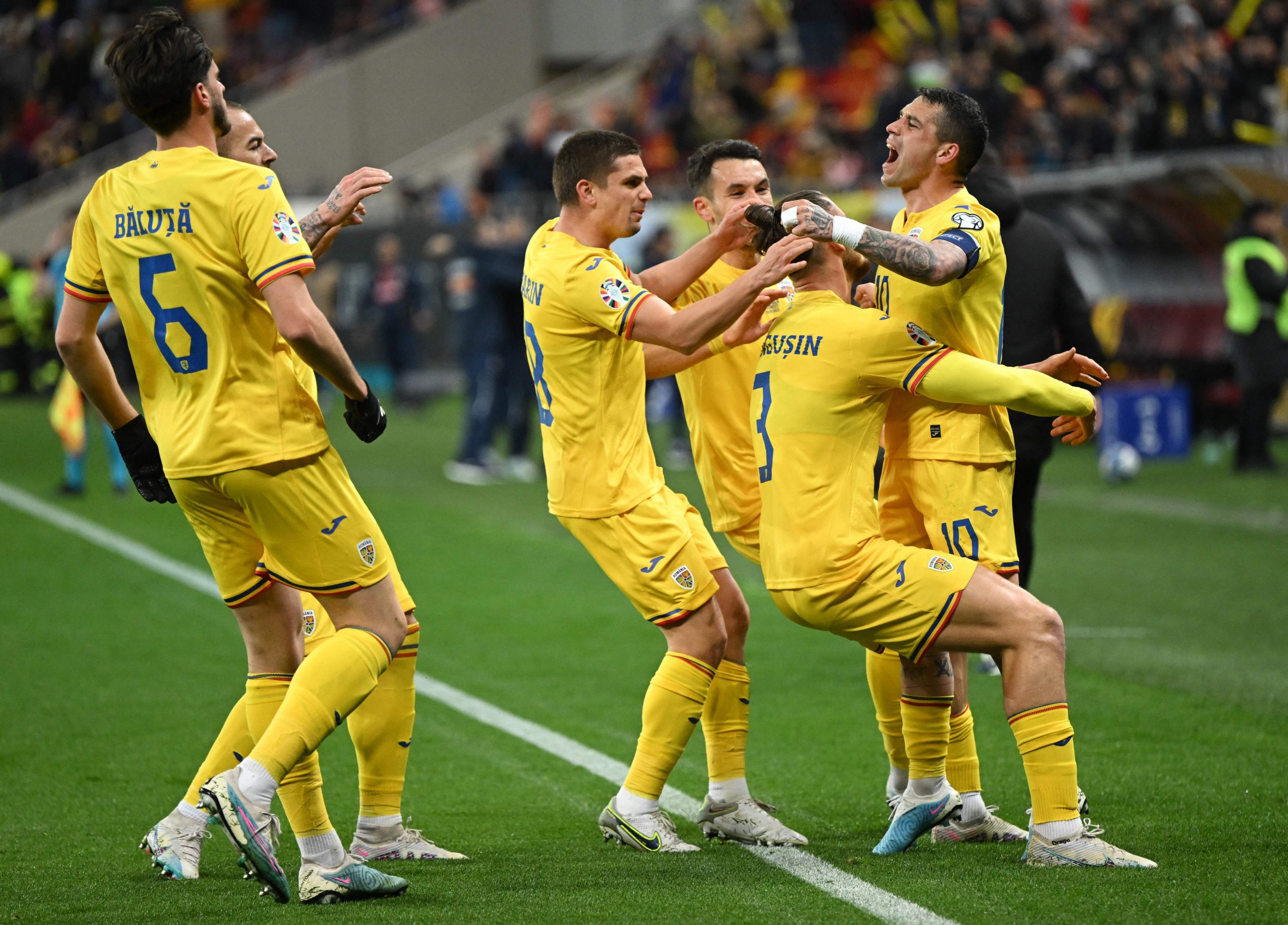 The Romania team celebrate a goal