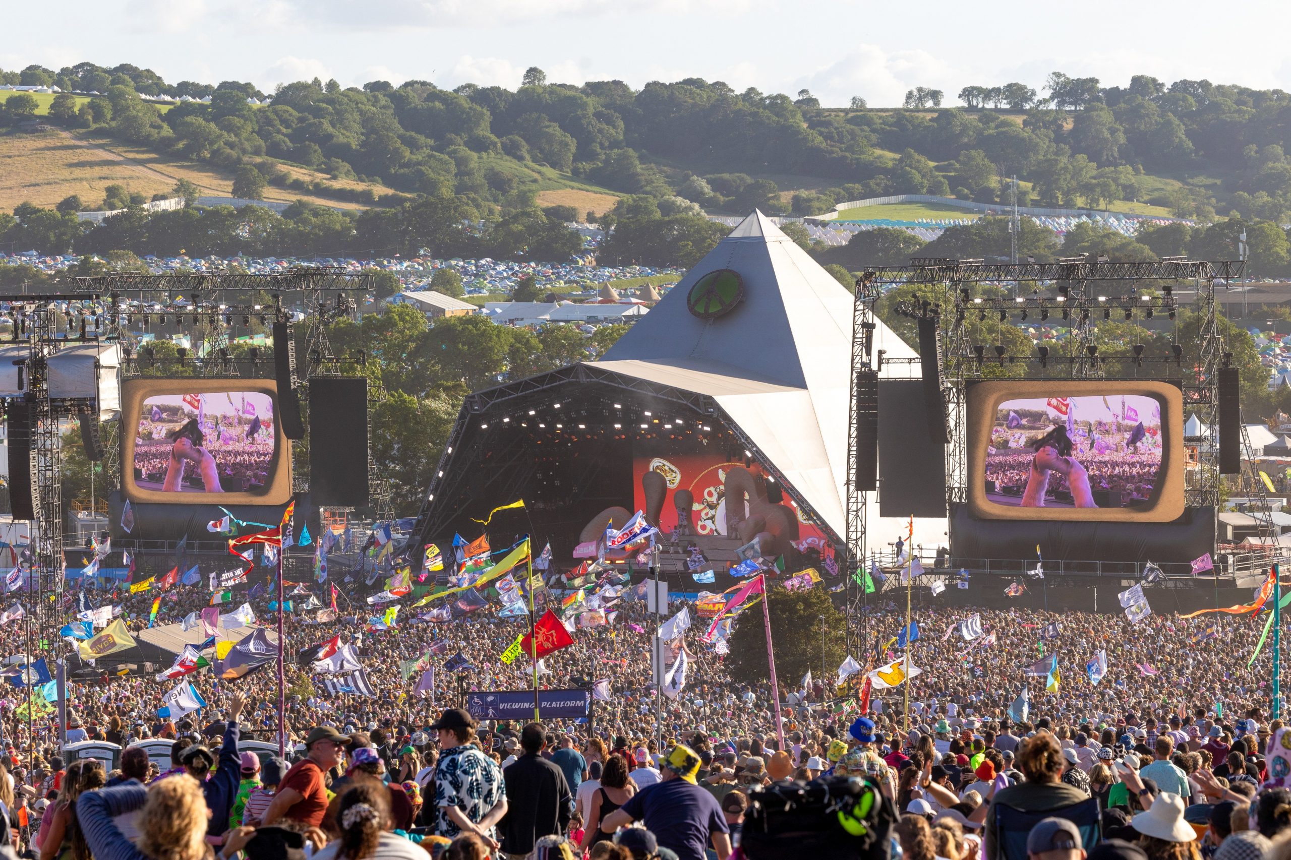 The crowd gathers to watch Elton John perform