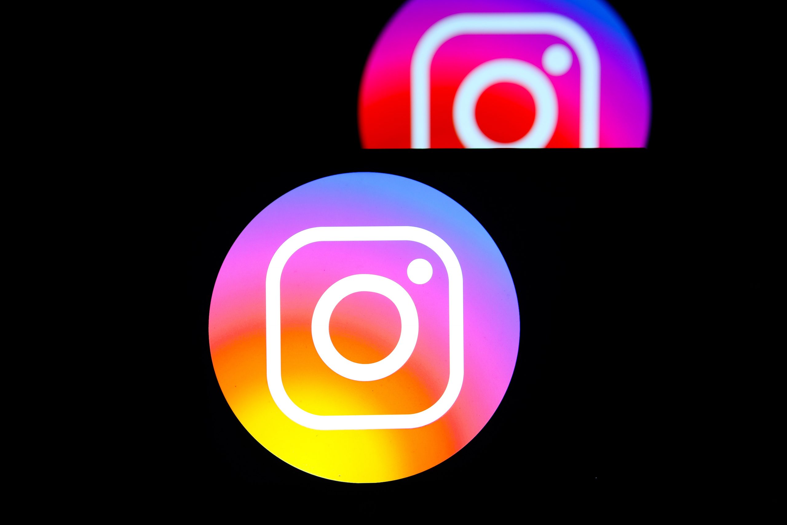 instagram logo back to back with another logo