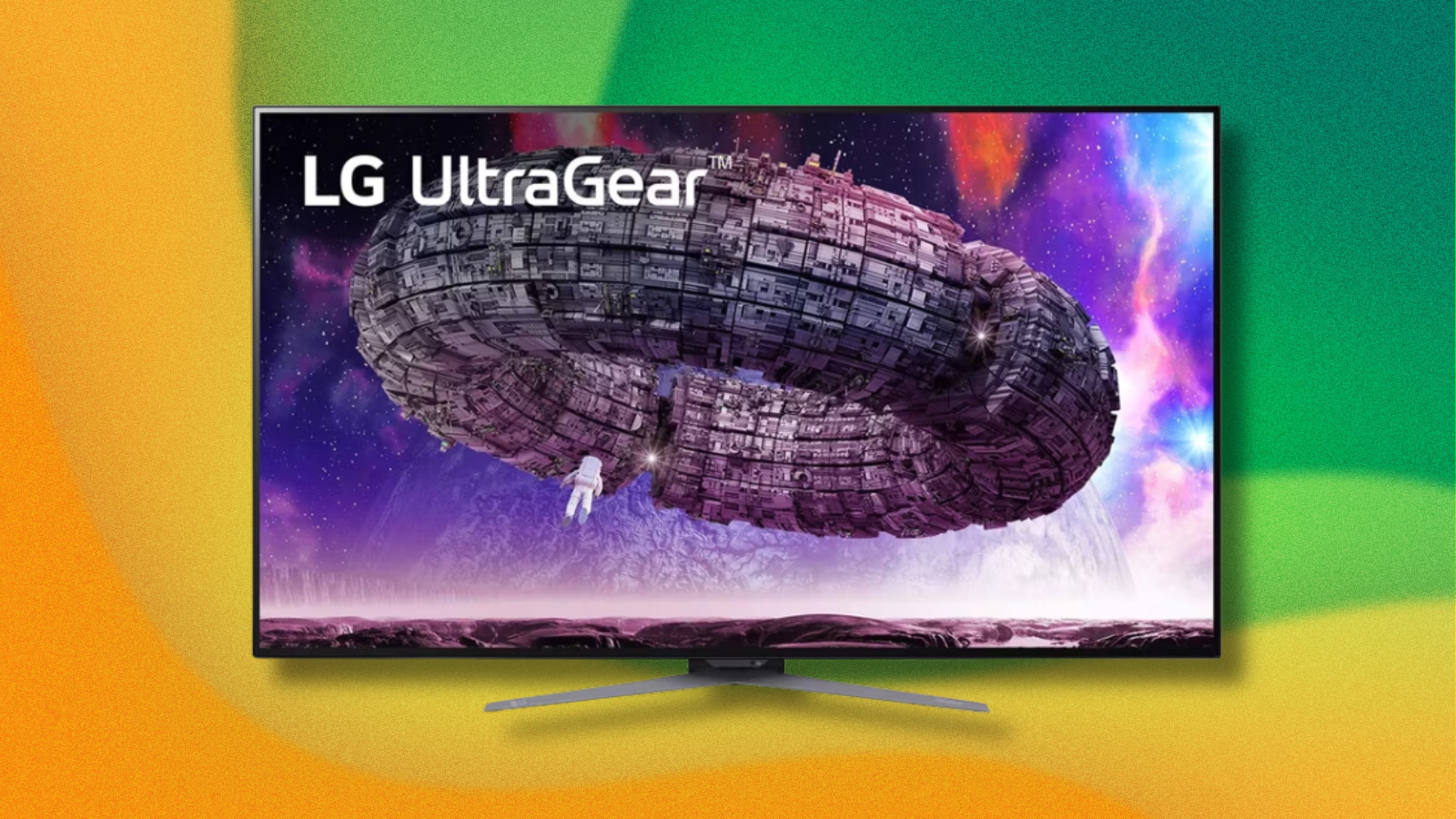 LG UltraGear OLED monitor on green and yellow abstract background