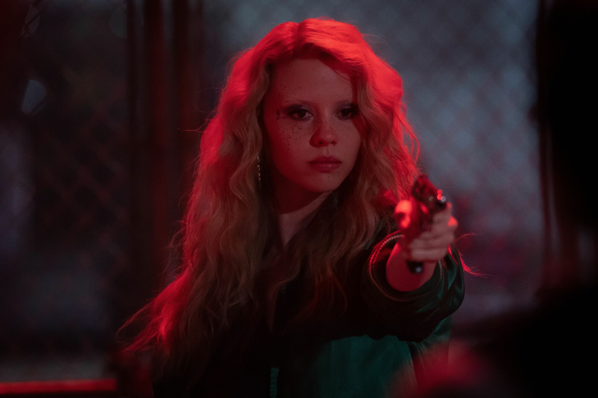 Mia Goth aims a gun in "MaXXXine."