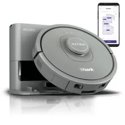 Gray Shark robot vacuum and dock beside smartphone with home map on screen