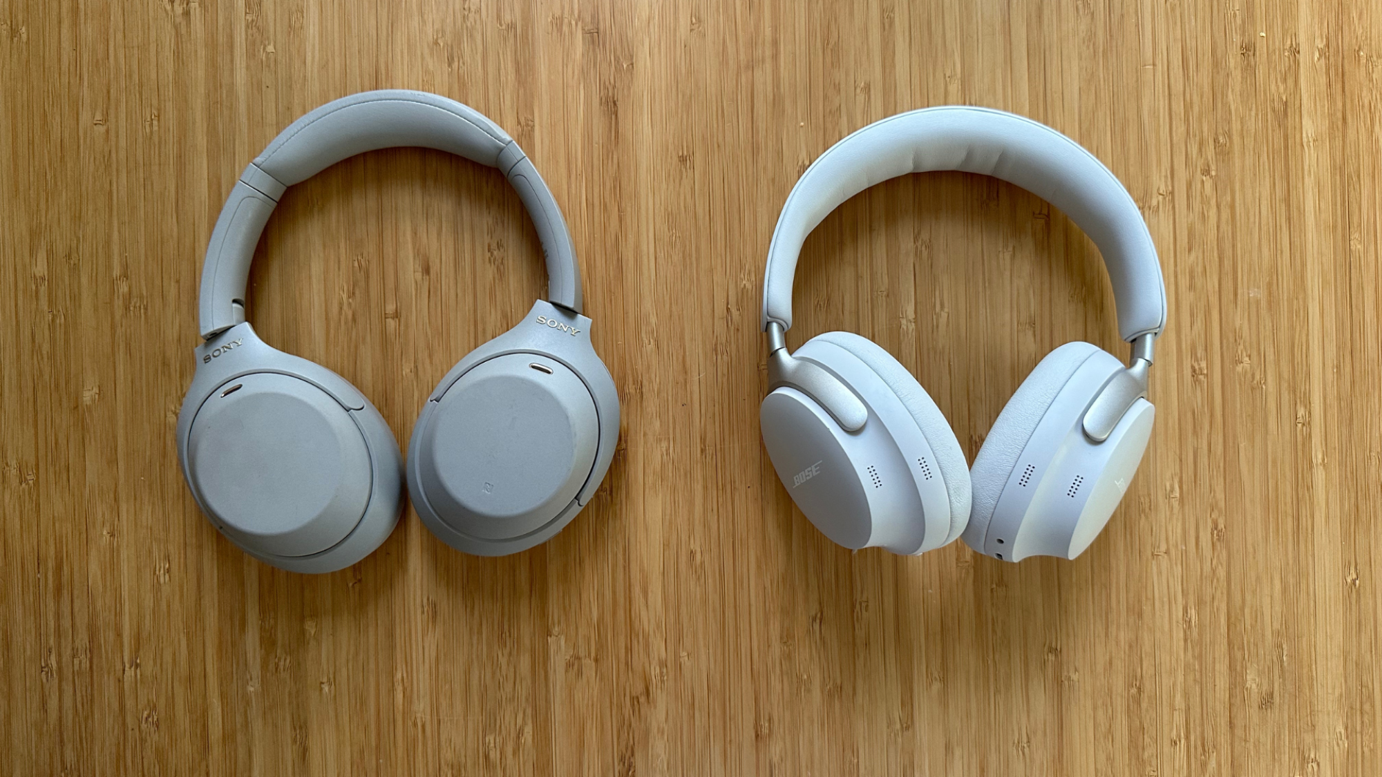 A pair of Sony WH-1000XM4 headphones (left) and Bose QuietComfort Ultra headphones (right).