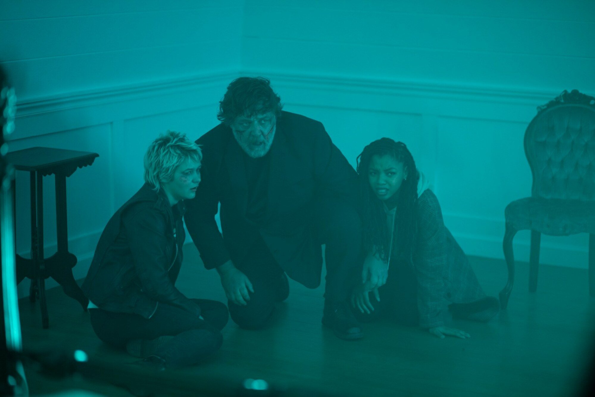 Ryan Simpkins, Russell Crowe, and Chloe Bailey in "The Exorcism."