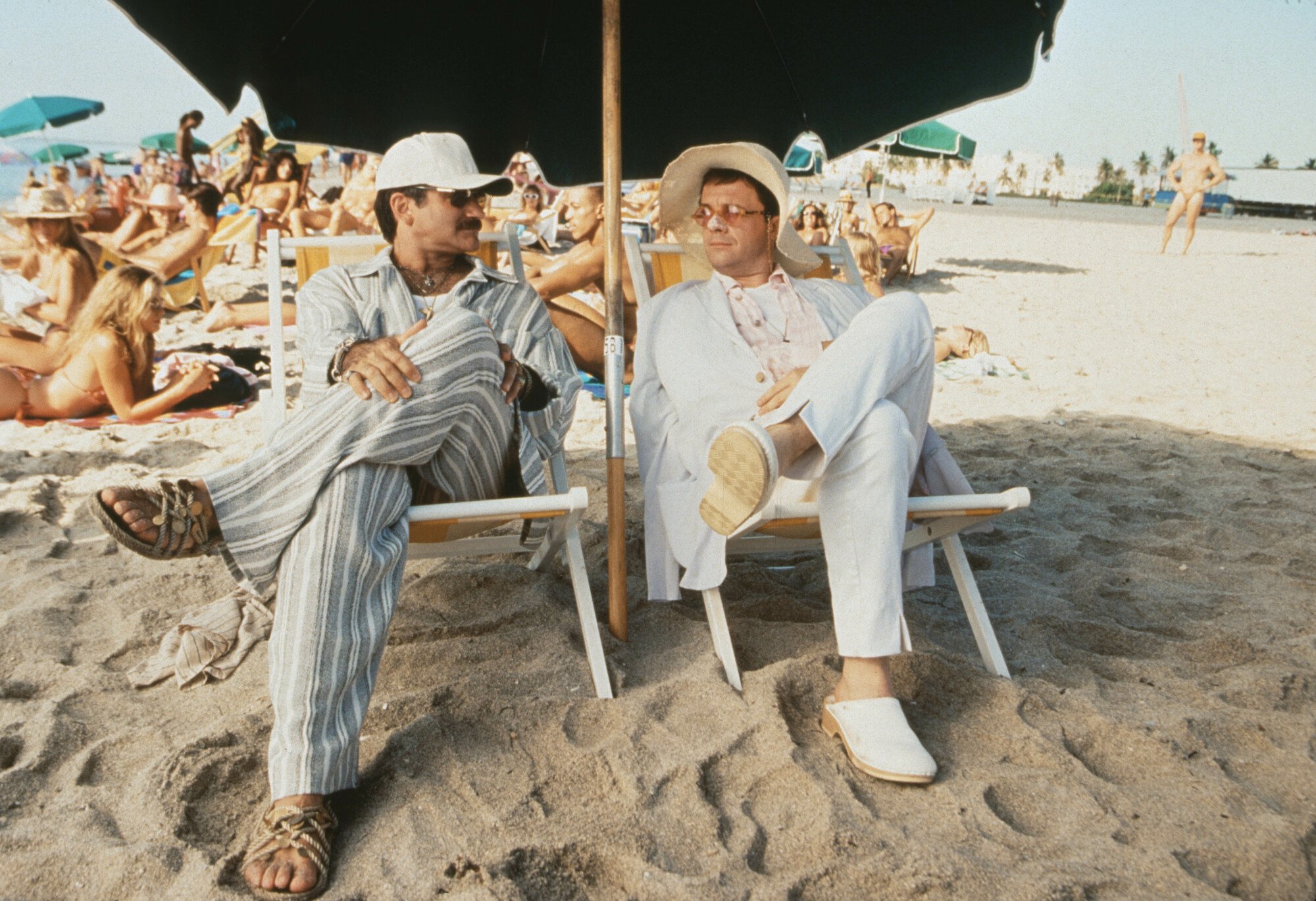 Robin Williams and Nathan Lane relax on a beach in "The Birdcage."