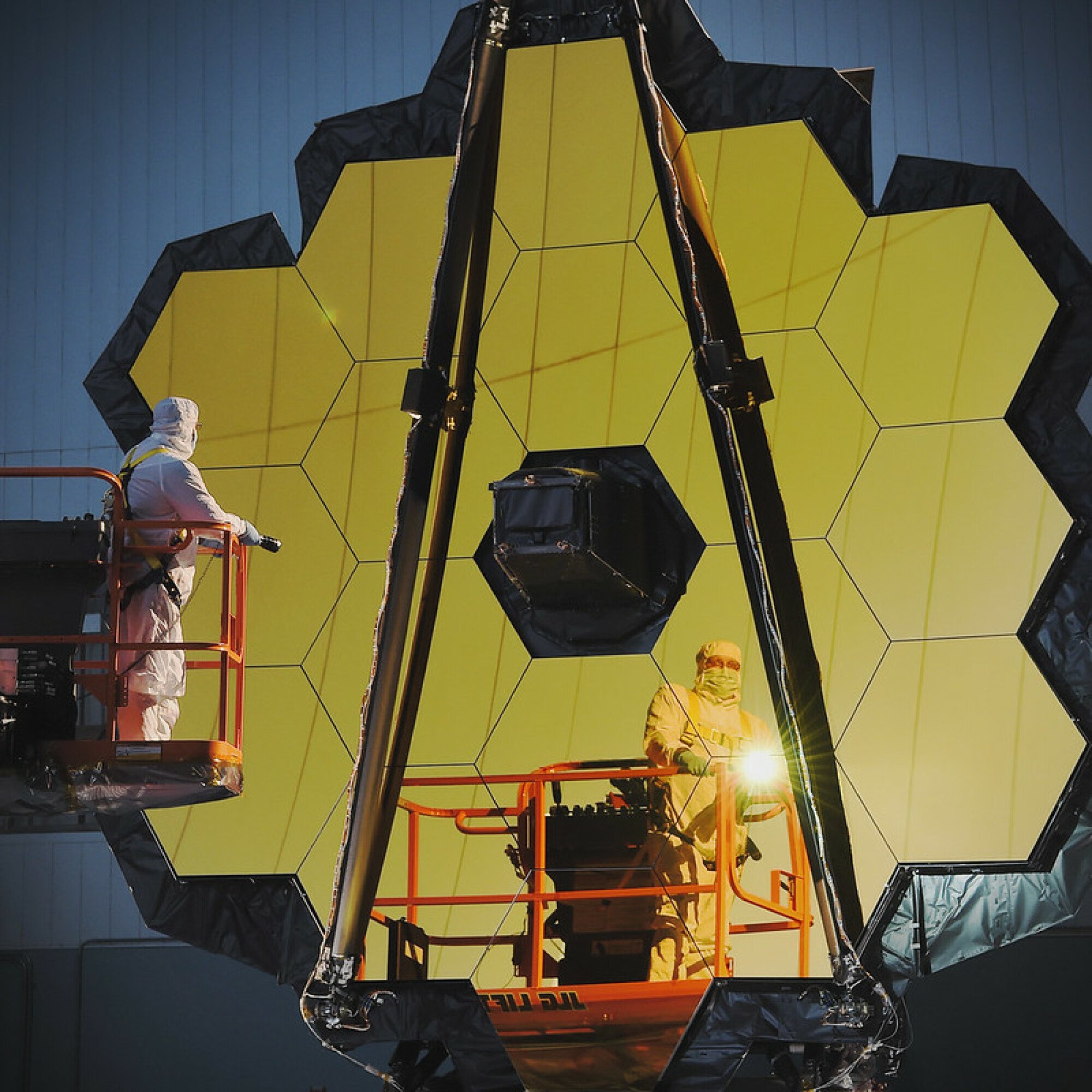 Before its launch, technicians work on the James Webb Space Telescope's mirror.