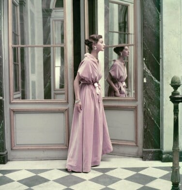 An image of a model in a pink ball gown.