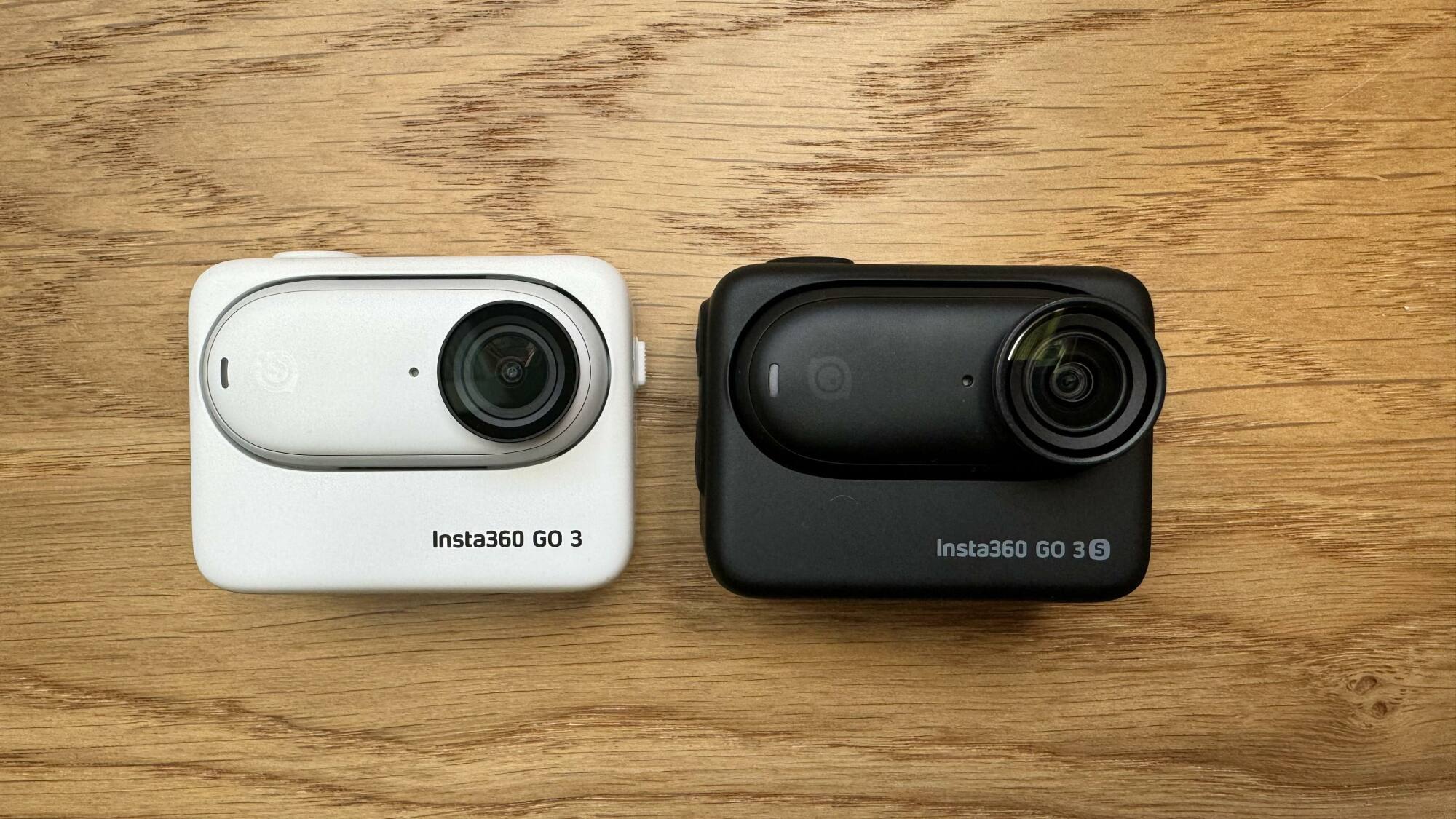 The Insta360 GO 3 and GO 3S side by side in their respective Action Pods.