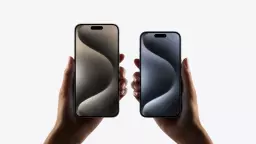 Two iPhone 15 Pros being held up next to each other