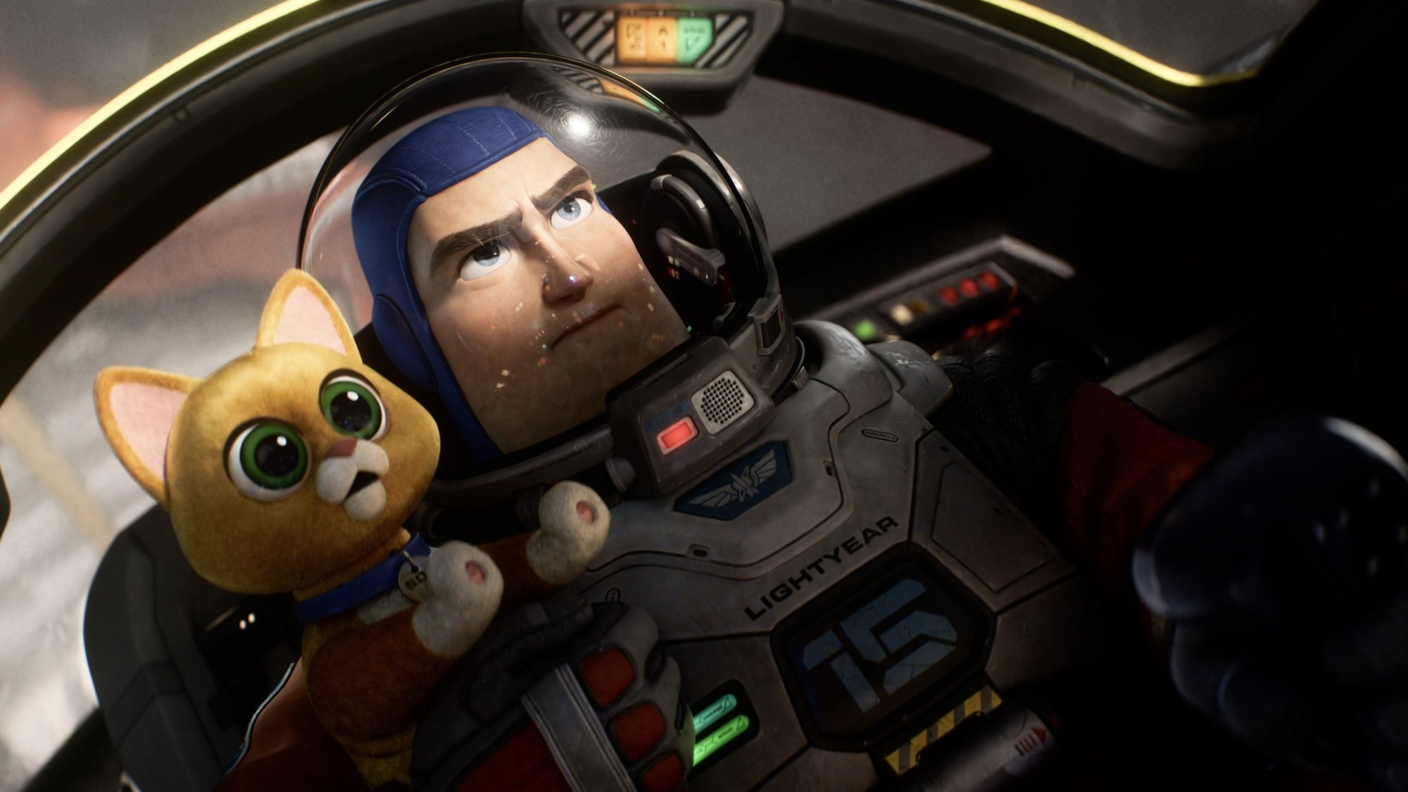 A man in a spacesuit and a robotic cat sit in the cockpit of a space shuttle.