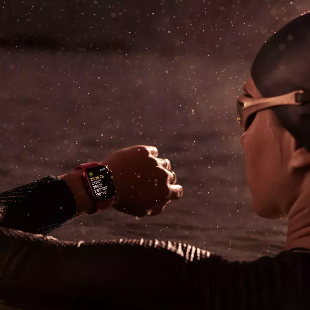 A swimmer wears an Apple Watch