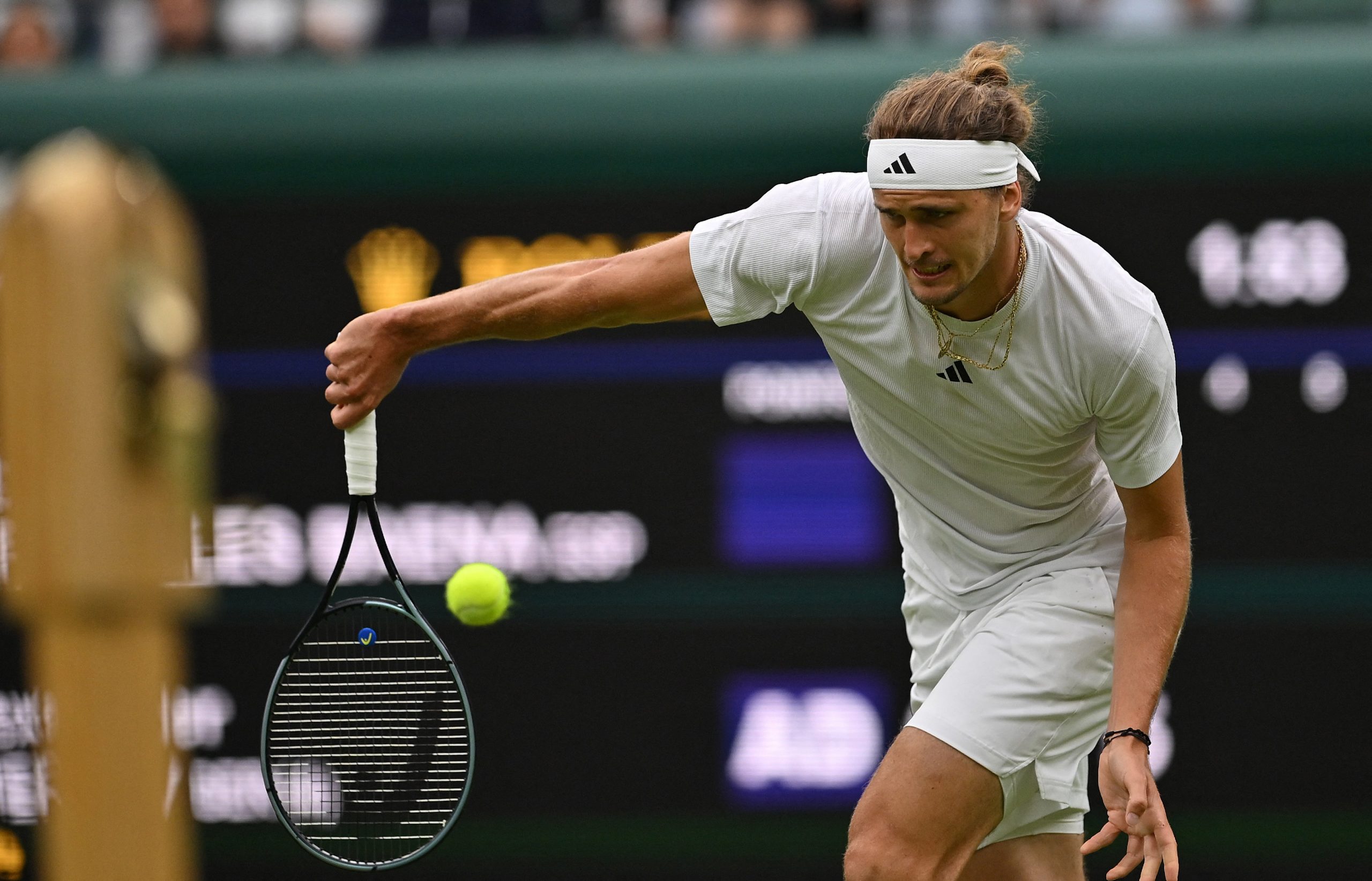 Alexander Zverev returns the ball at Wimbledon